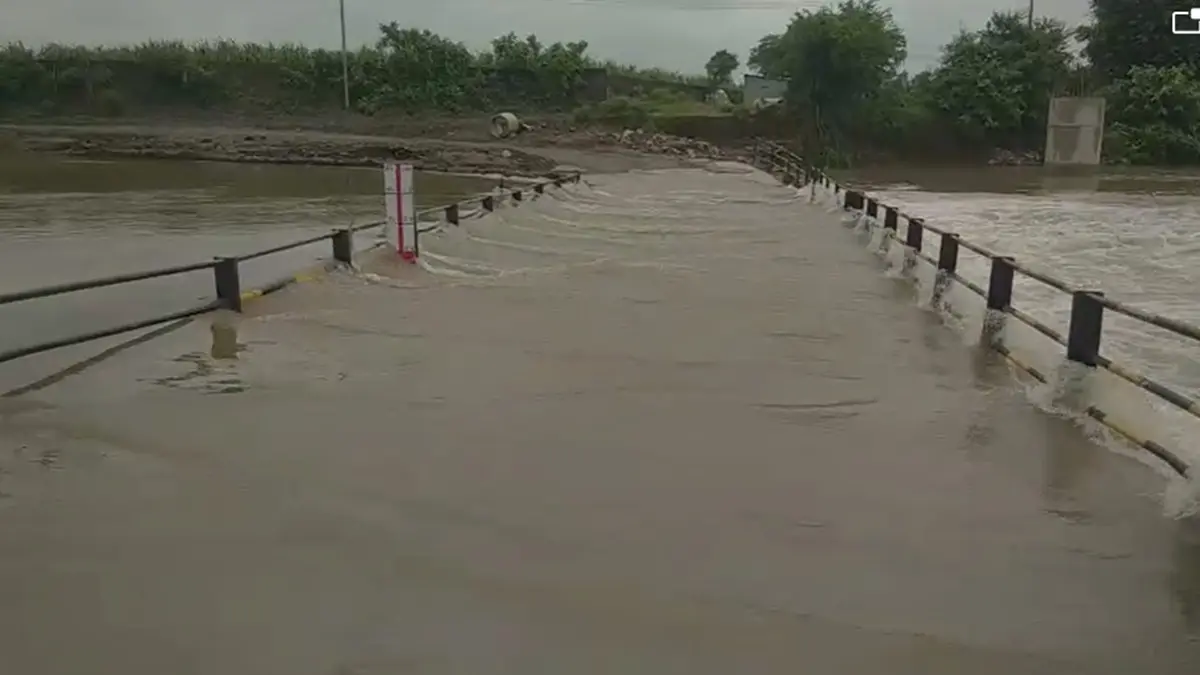 the-water-of-the-vavya-creek-overflowed-on-the-low-level-bridge-near-munjlav-village-in-mandvi-surat-district-591605