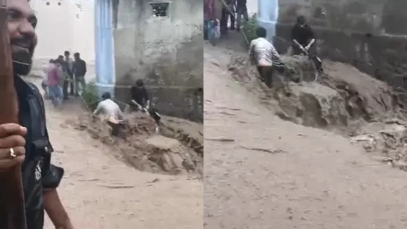 amreli-rain-savarkundla-floods-bike-rider-rescued-amid-heavy-downpour-video-goes-viral