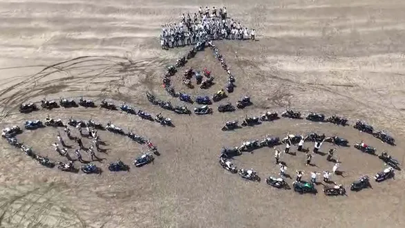 surat-navratri-2026-bikers-create-maa-durgas-face-with-71-bikes-at-dabhari-beach-watch-drone-video