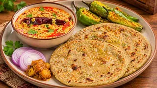 Gujarati Bajra No Rotlo: બાજરીના રોટલા સાથે દહીં તડકા અને મસાલેદાર ભરેલા મરચાંનું બેસ્ટ કોમ્બિનેશન, આંગળા ચાટતા રહી જશો